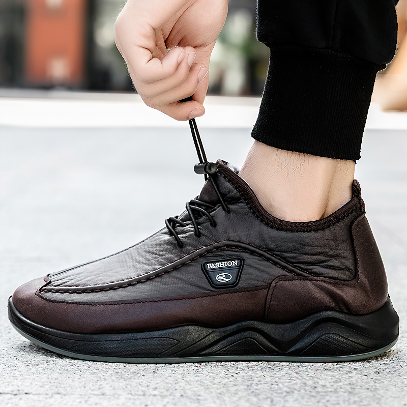Stylish black and brown leather alternative sneakers for men, featuring lacing and a fashionable sole.