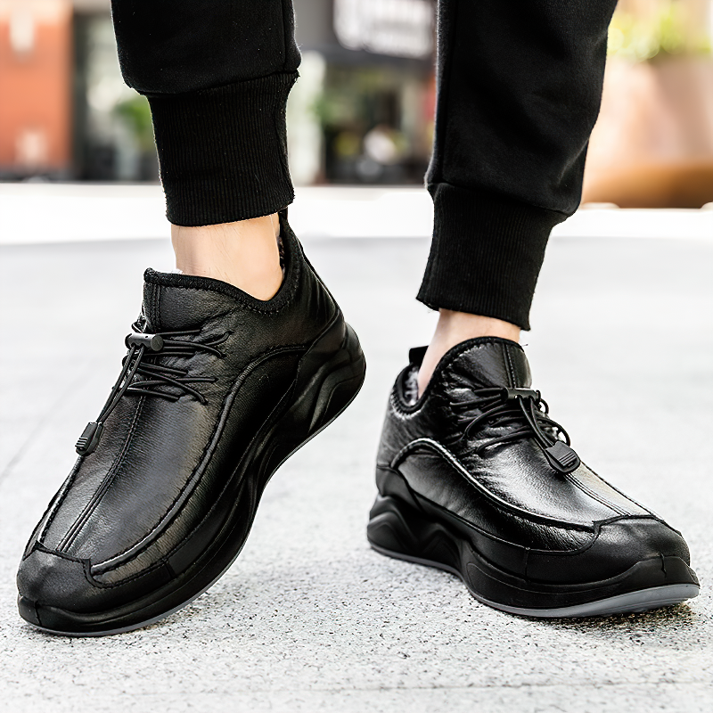 Stylish black leather alternative sneakers for men, perfect for spring and fall, featuring lacing and a trendy sole.