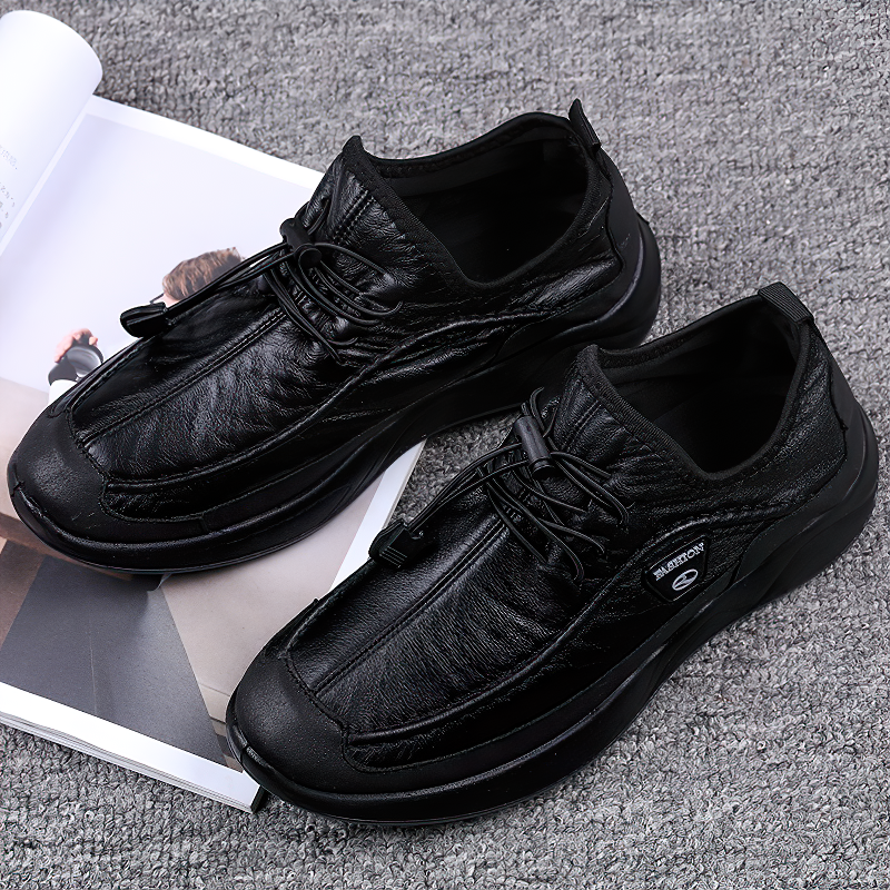 Stylish waterproof leather alternative men's sneakers in black with lacing, perfect for spring and fall wear.