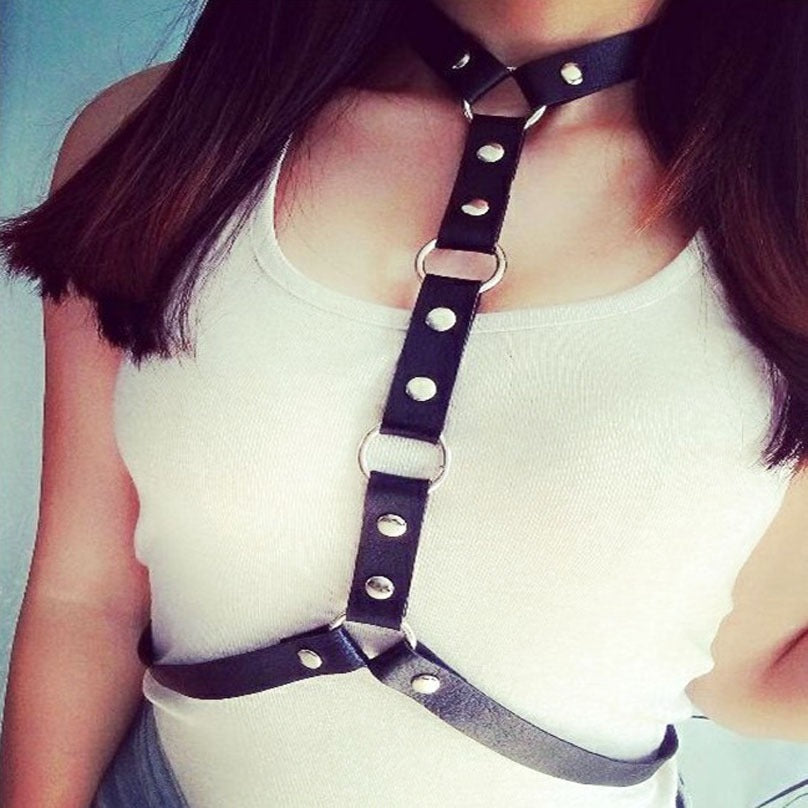 Womens gothic leather body harness with choker and decorative rivets, perfect for cosplay and festivals.