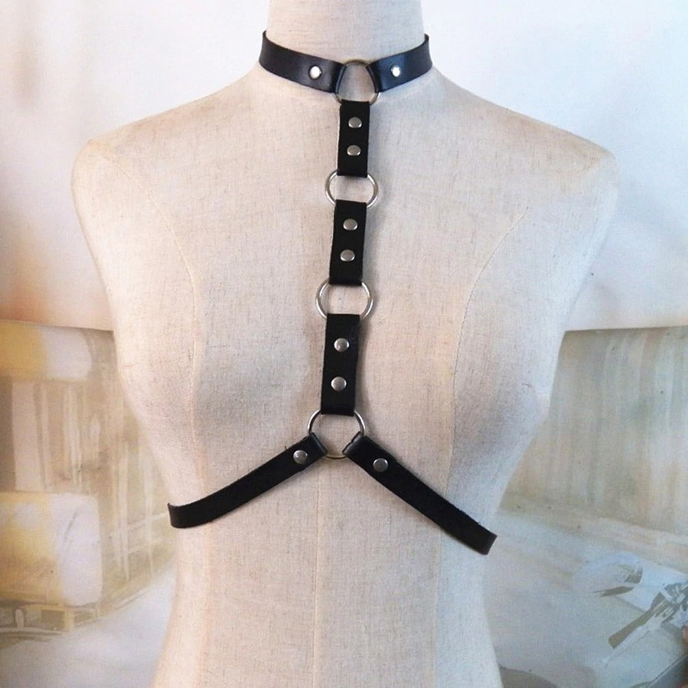 Gothic leather body harness with choker, adjustable straps, rings and rivets for stylish women cosplay festival outfits.