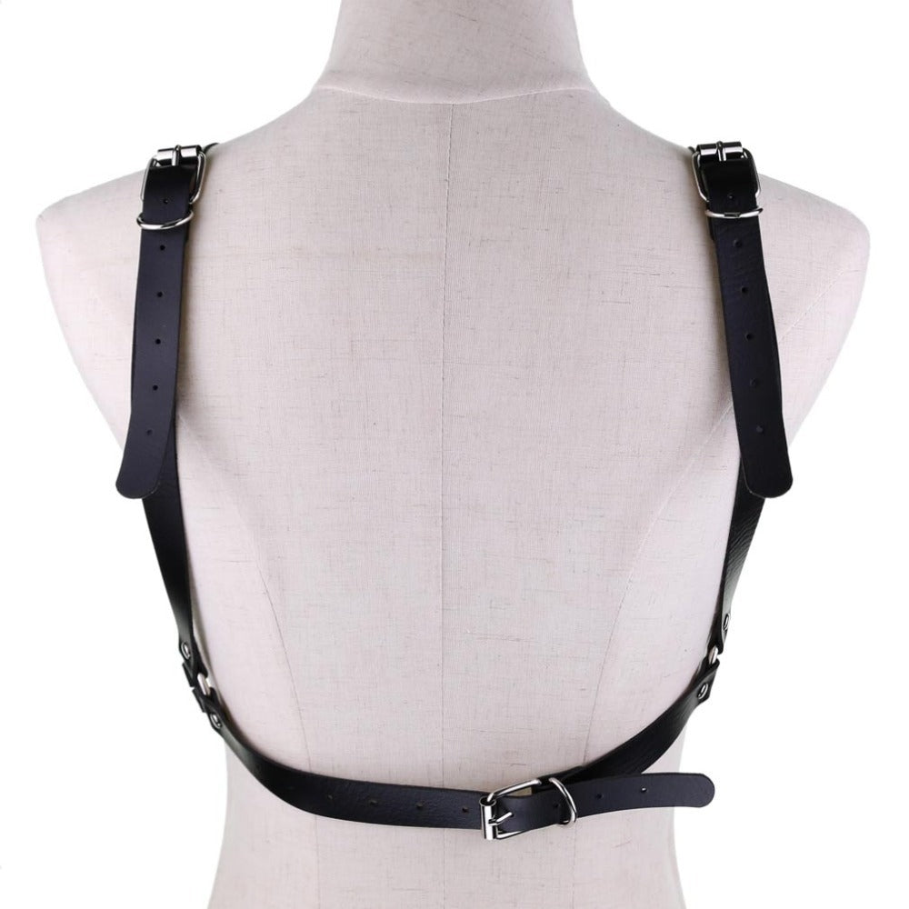Back view of women's leather chain body harness showcasing adjustable faux leather straps and metal buckles.