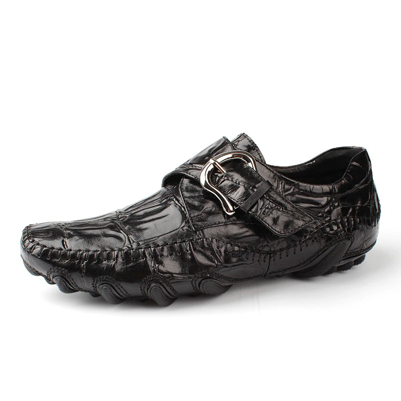 Stylish black leather crocodile pattern loafers with buckle detail for men, ideal for casual and formal occasions.
