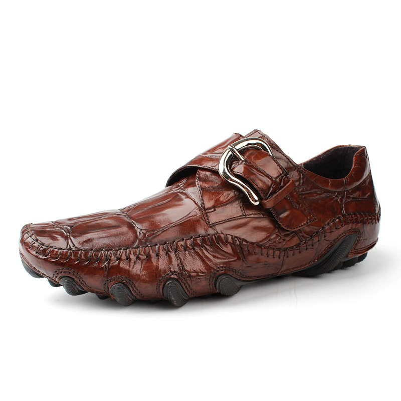 Brown leather crocodile pattern loafers with buckle, stylish and casual shoes for men.