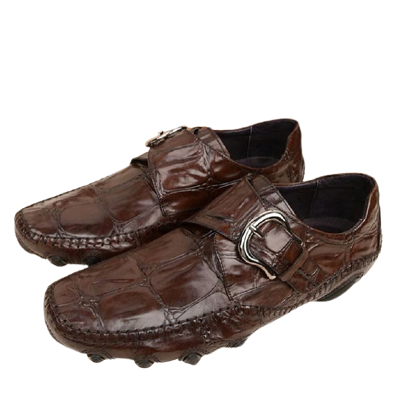 Brown leather crocodile pattern loafers with trendy buckle, perfect for casual and formal occasions.