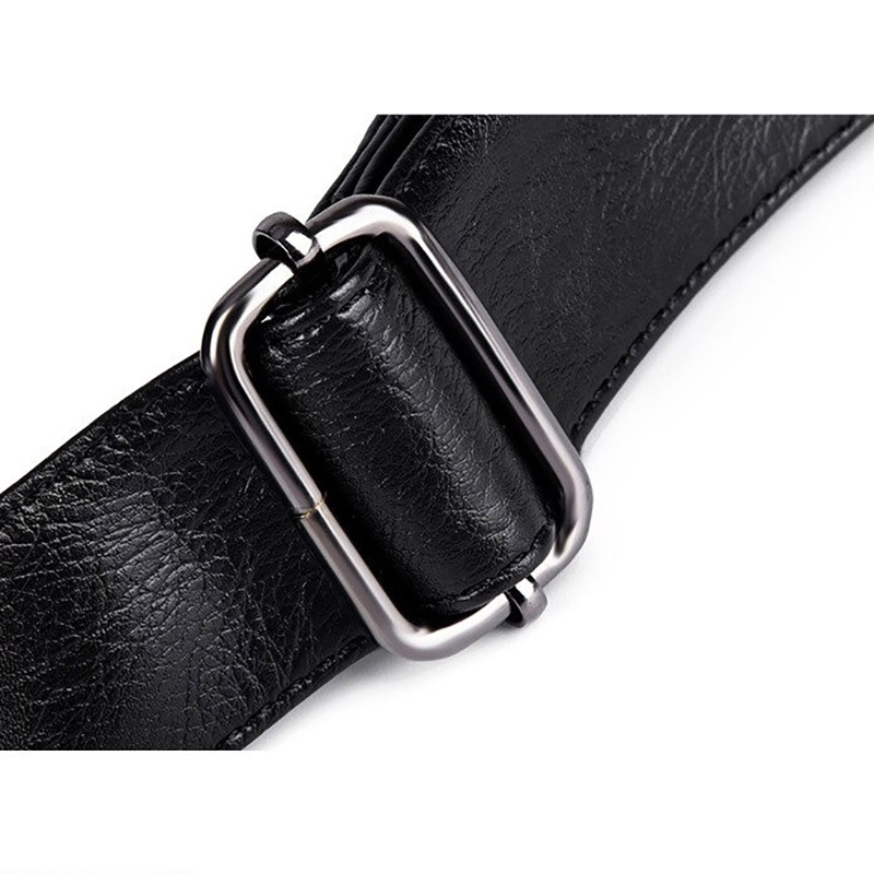 Close-up of a black leather strap with a metallic buckle, ideal for men's gothic style bags.