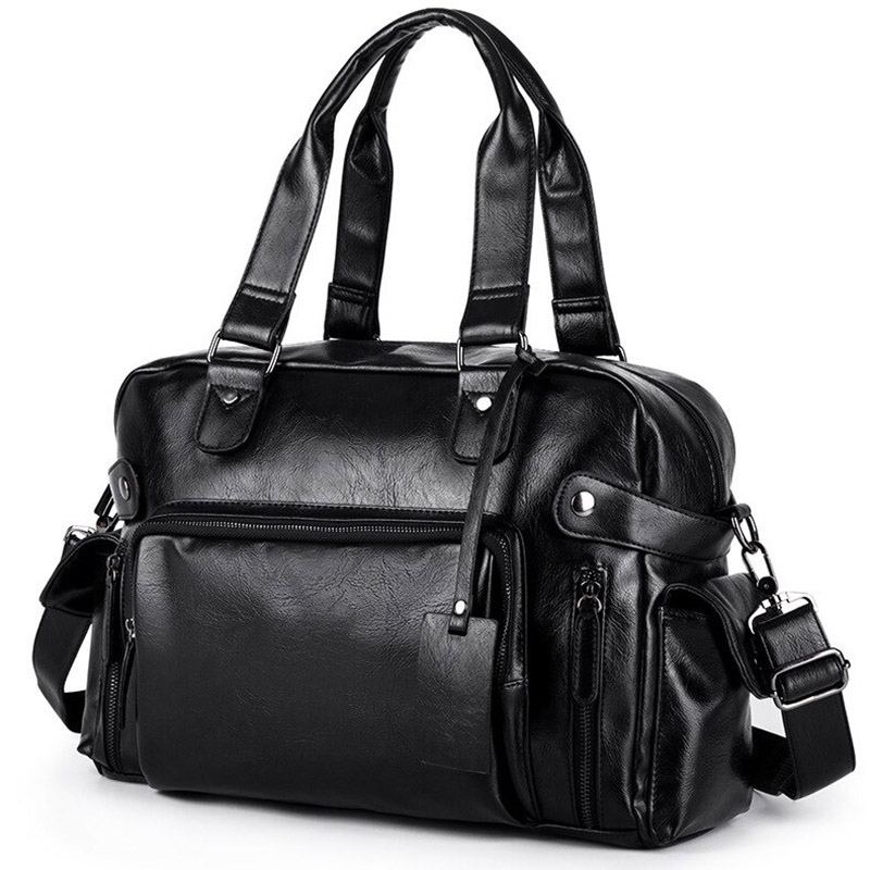 Stylish black leather messenger bag with multiple pockets, ideal for travel and goth fashion.