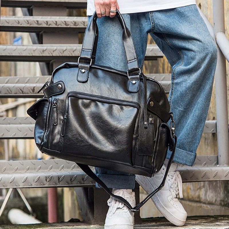 Men's leather messenger bag with multiple pockets, perfect for gothic style travel and casual outings.