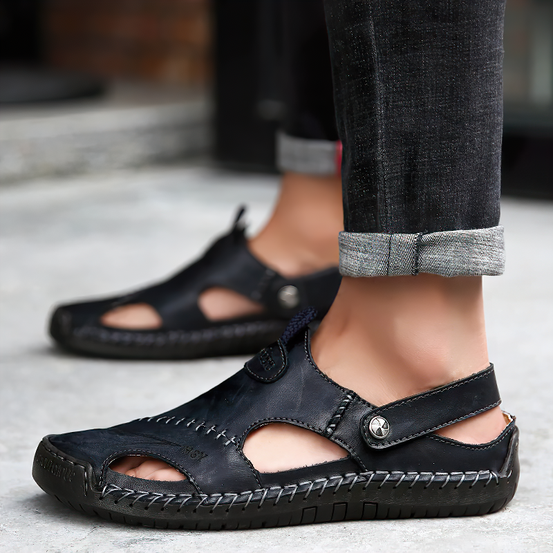 Stylish leather men's sandals with cutouts, perfect for summer outings and casual wear in black.