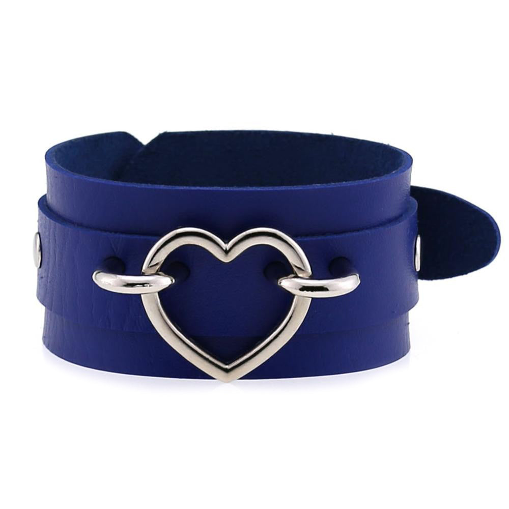 Blue leather cuff bracelet with a heart-shaped silver decoration, stylish and unisex accessory.
