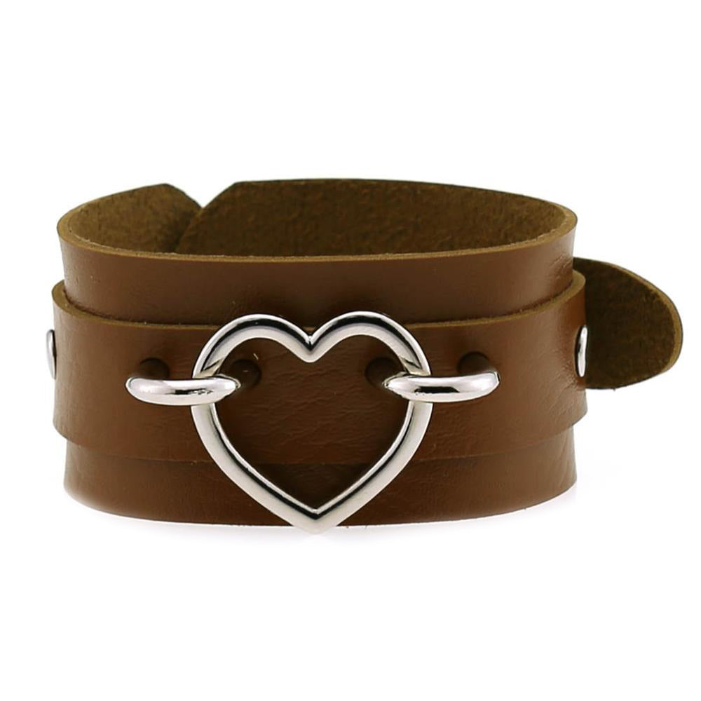 Brown leather cuff bracelet with silver heart detail, perfect for unisexual emo fashion.