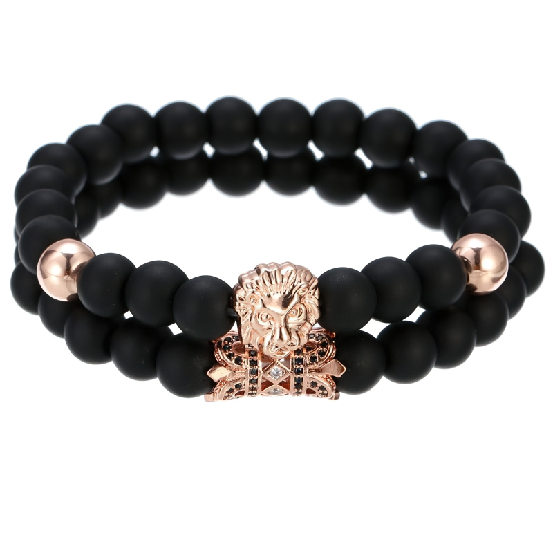 Unisex lion bracelet with black stone beads and crown accent - stylish alternative fashion accessory.
