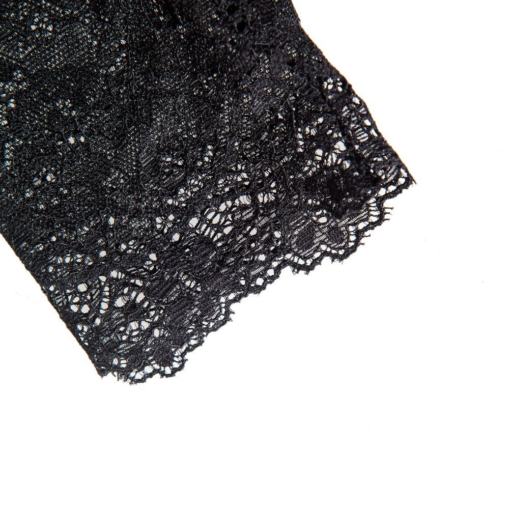 Elegant lace edge of black gloves, perfect for adding gothic flair to outfits and enhancing delicate hands.