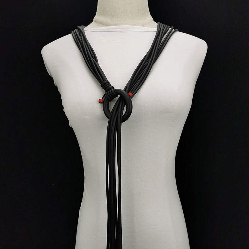 Gothic handmade long necklace for women featuring adjustable black rubber with striking red beads.