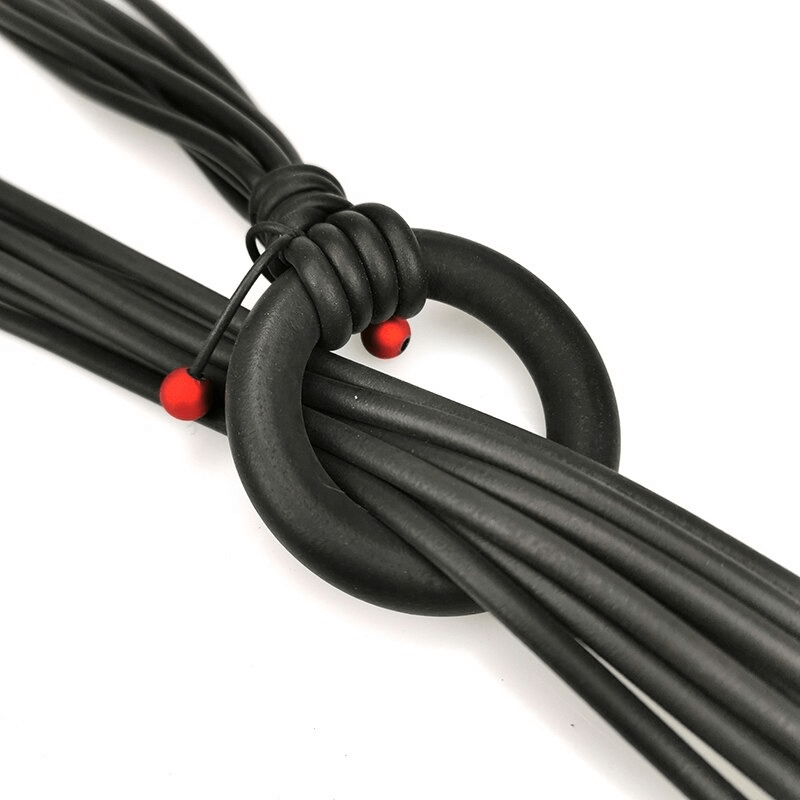 Close-up of adjustable long gothic necklace with red beads and rubber materials, perfect for stylish women's outfits.