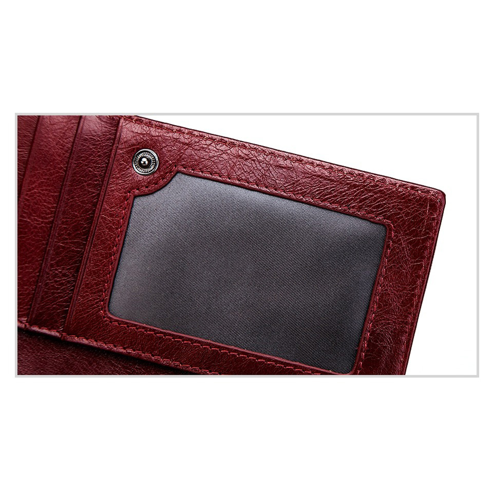 Detail of a luxury genuine leather wallet featuring a clear ID pocket, perfect for storing essentials stylishly.