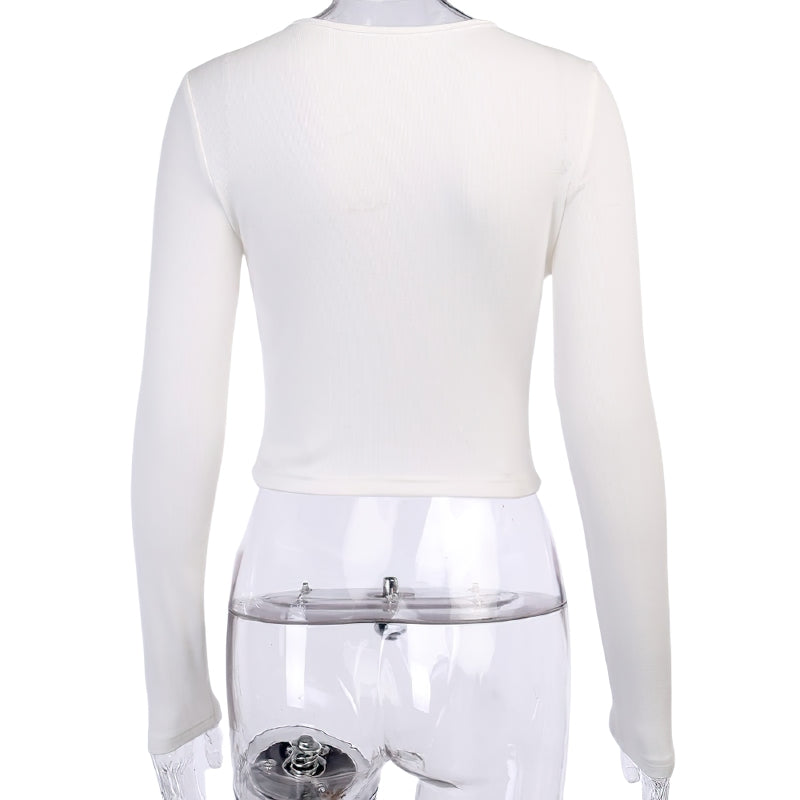 Back view of a long sleeve gothic crop top, solid white, showcasing stylish ribbed texture and fitted design.