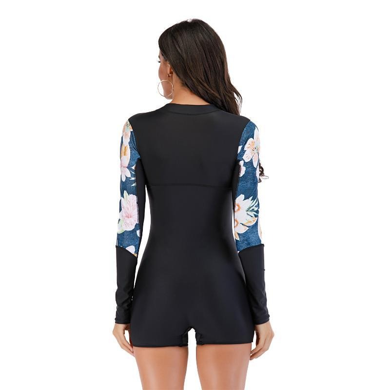 Back view of long sleeve women's swimsuit with floral pattern, perfect for summer pool activities.