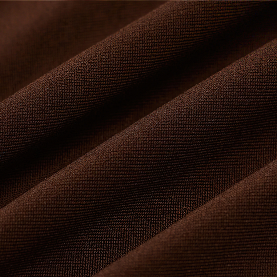 Close-up of soft, textured brown fabric for women's jumpsuits made of spandex and polyester.