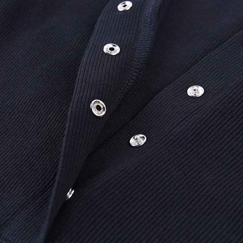 Close-up of stylish navy ribbed bodysuit with shiny buttons for a sexy, elegant look.
