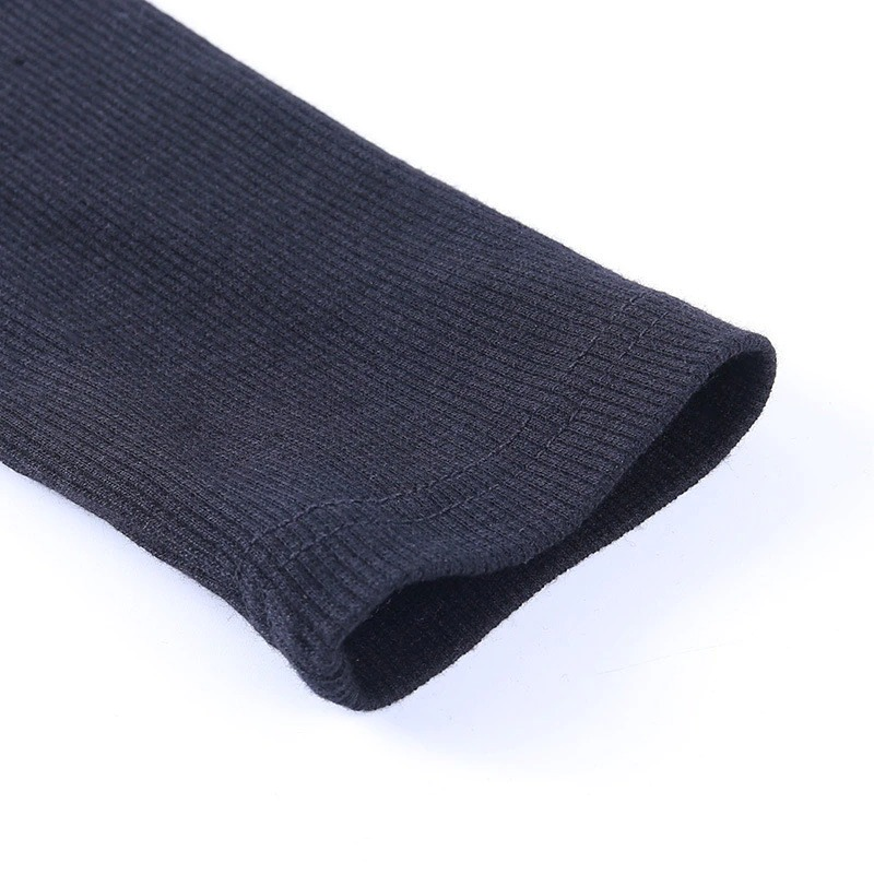 Close-up of the sleeve of a long sleeve ribbed women's bodysuit, showcasing the textured fabric in a dark color.