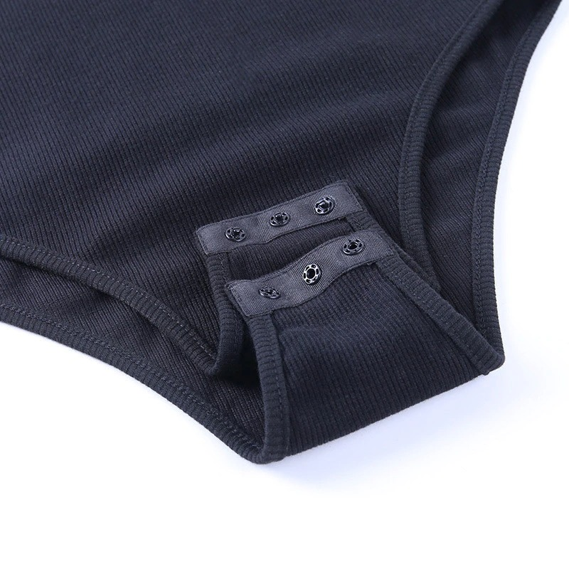 Close-up of black ribbed women's bodysuit featuring stylish button detail, perfect for rock and goth outfits.