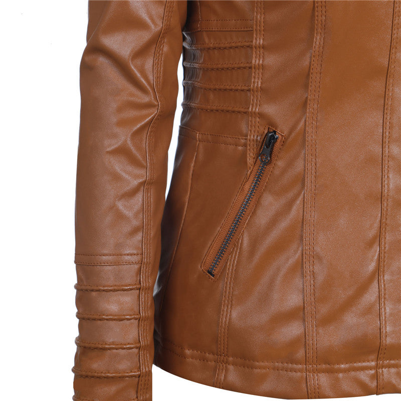 Close-up of women's long-sleeved brown leather jacket featuring a zipper pocket and stylish stitching details.