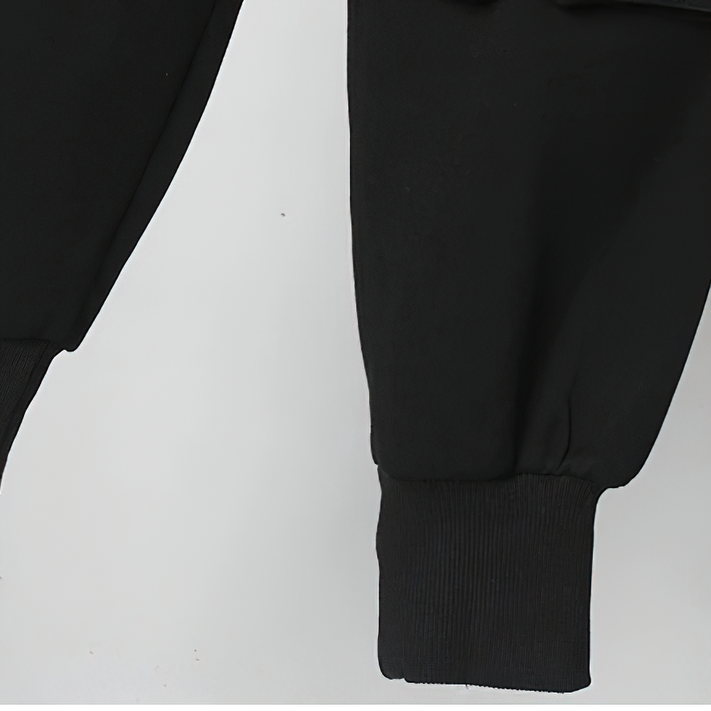 Close-up of black elastic waist pants showcasing comfortable cuffs and quality fabric for casual wear.