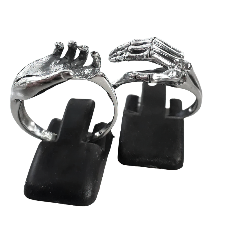 Unisex skeleton hands puzzle rings for couples in stainless steel, showcasing unique alternative jewelry design.