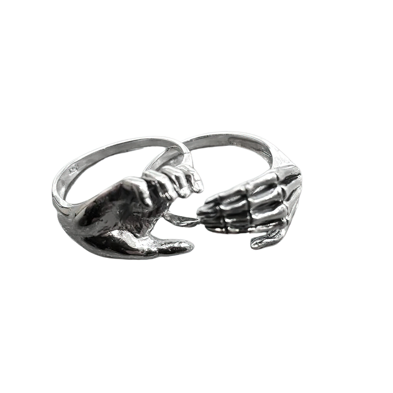 Unisex skeleton hands puzzle rings in stainless steel, a unique accessory for couples.