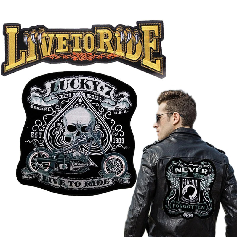 Bold embroidered biker patches, including 'Live to Ride' and 'Lucky,' showcased on a stylish black leather jacket.