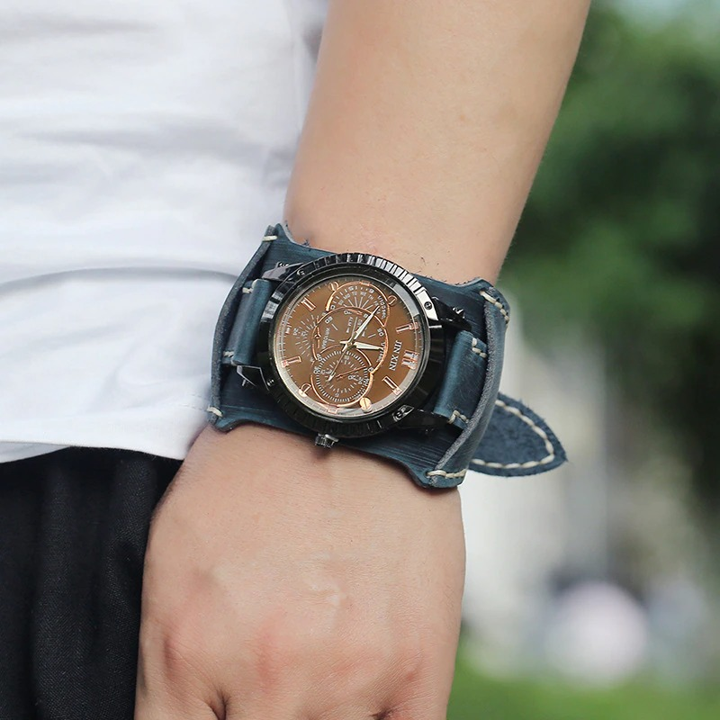 Luxury big dial quartz watch on a man's wrist with a stylish wide leather strap, perfect for casual and formal wear.