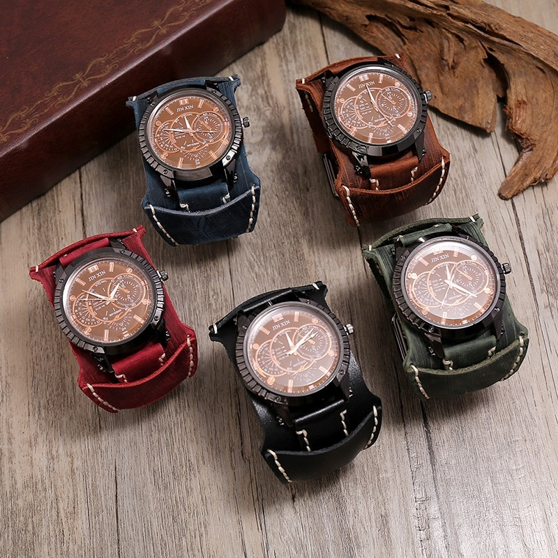 Array of luxury big dial quartz men's watches with wide leather bracelets in five colors - black, blue, brown, red, and green.