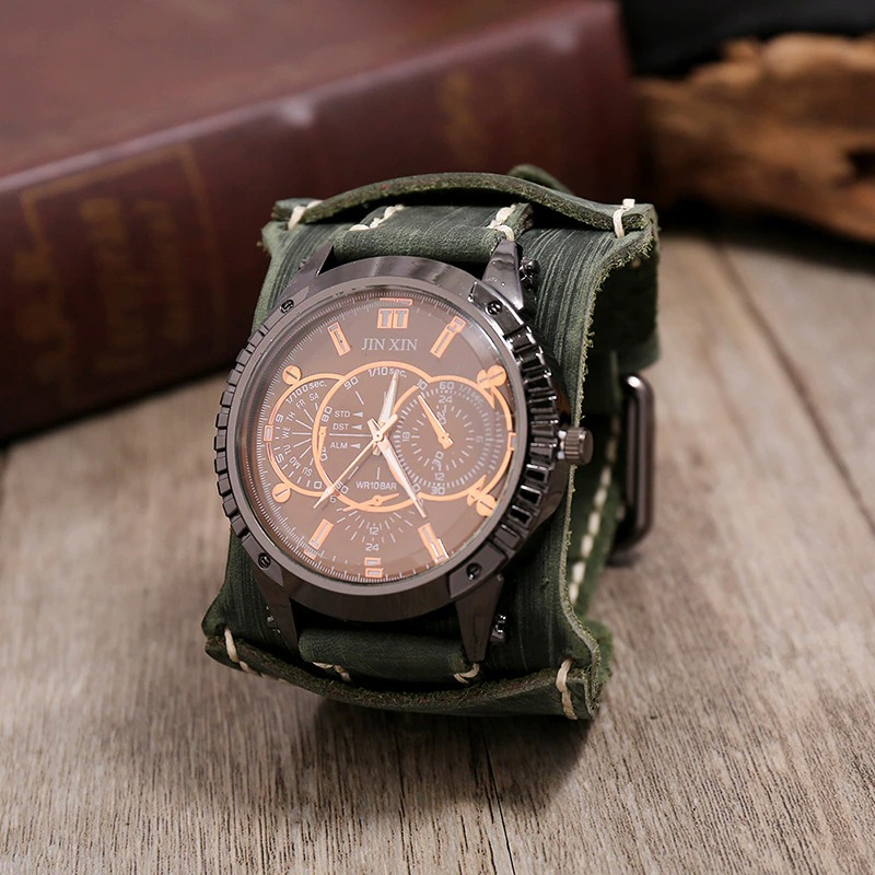 Luxury big dial quartz men's watch with a stylish green leather strap on a wooden surface.