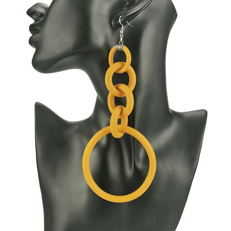 Bold handmade long silicone drop earrings in vibrant yellow, perfect for enhancing casual outfits.