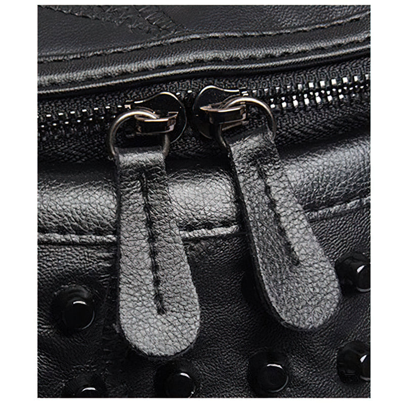 Close-up of the luxurious zippers on a black women's sheepskin bag, highlighting rivets and premium leather texture.