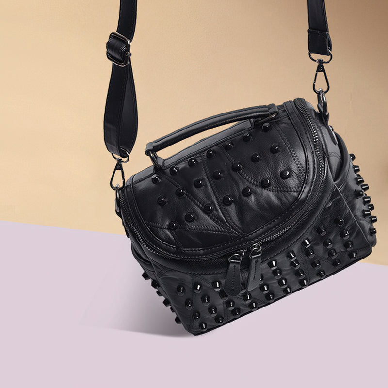 Luxury black women's sheepskin bag with rivets, perfect for any occasion, stylish leather messenger bag.