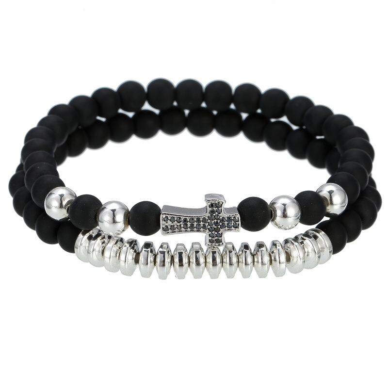 Luxury unisex bracelet featuring natural lava stone beads and silver cross, perfect for alternative fashion outfits.