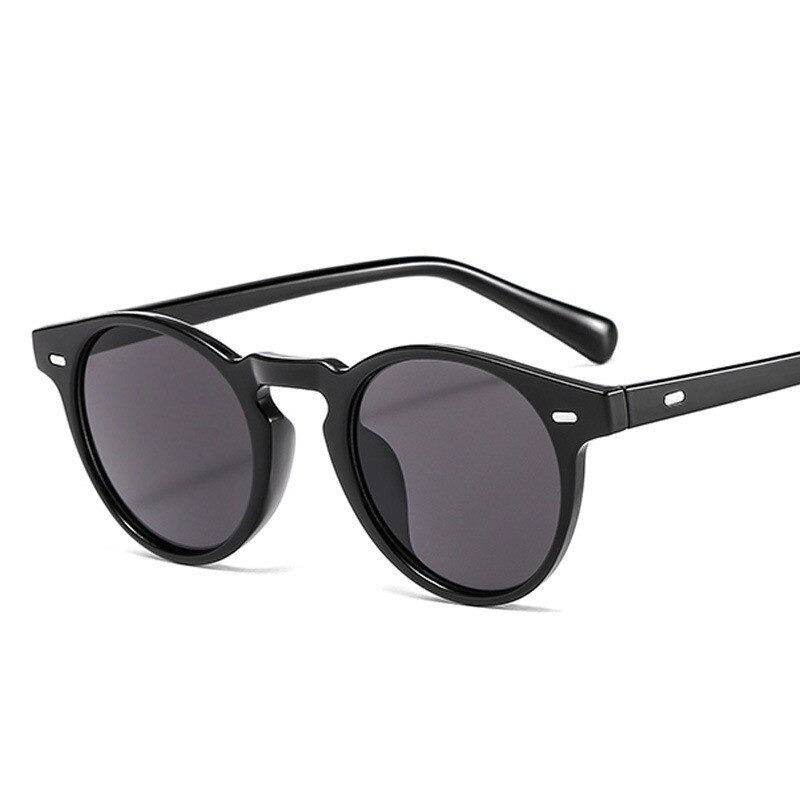 Trendy unisex luxury brand designer sunglasses in black; stylish accessory for men and women, perfect for casual outfits.