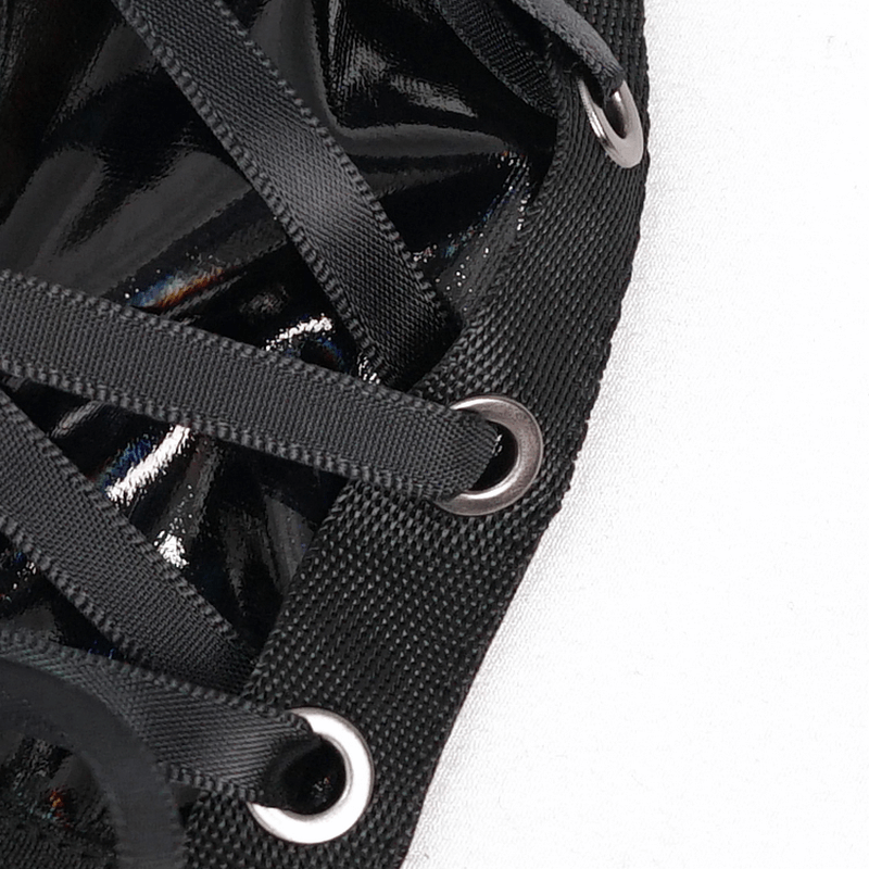 Close-up of black faux leather lacing detail from a luxury gothic lingerie set for women.
