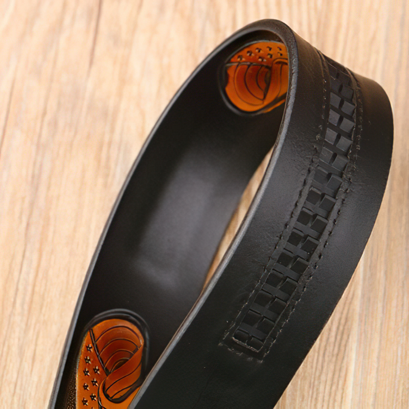 Luxury black genuine leather belt featuring intricate design, perfect fashion accessory for men.