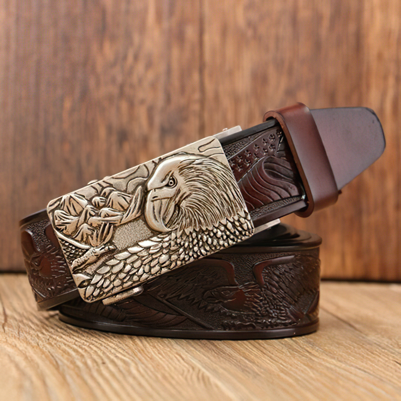 Luxury men's leather belt with intricate eagle print buckle, showcasing high-fashion style and craftsmanship.