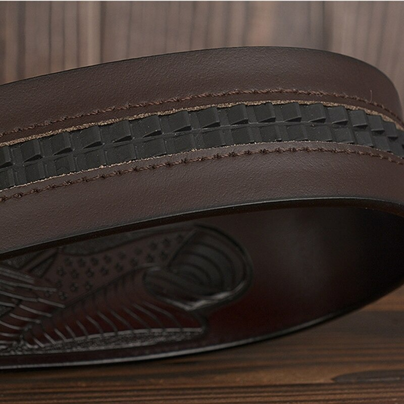 Close-up of a luxury brown leather belt showcasing an intricate eagle print and stylish woven design.