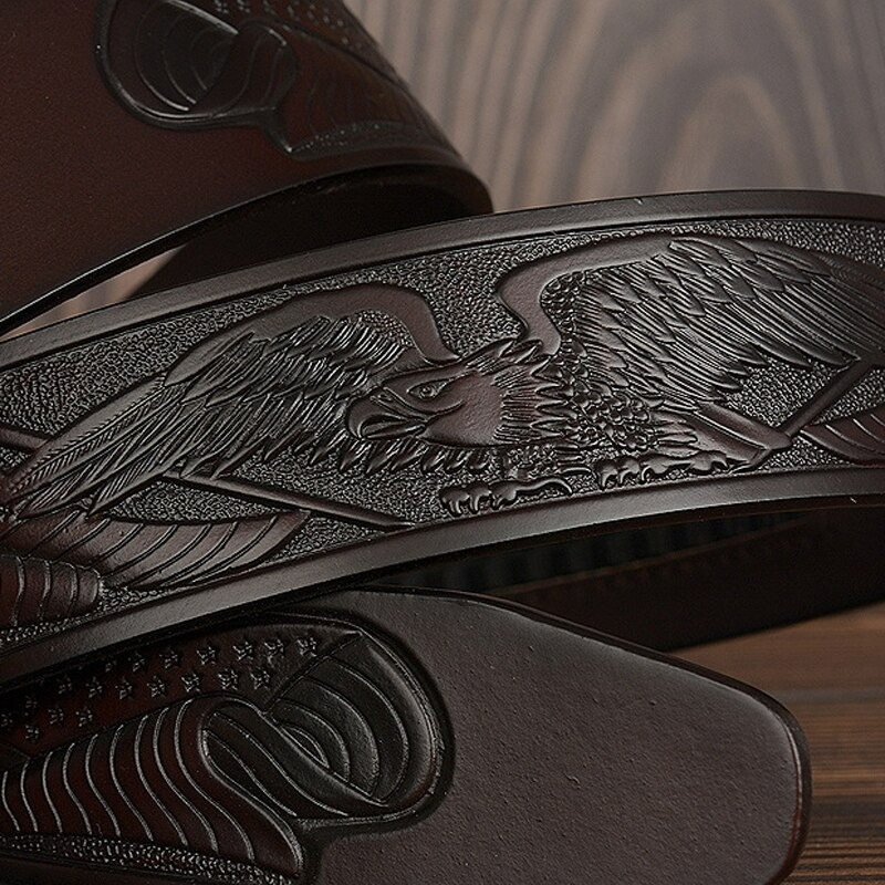 Luxury leather belt for men featuring a detailed eagle print, perfect for fashion-forward styles.
