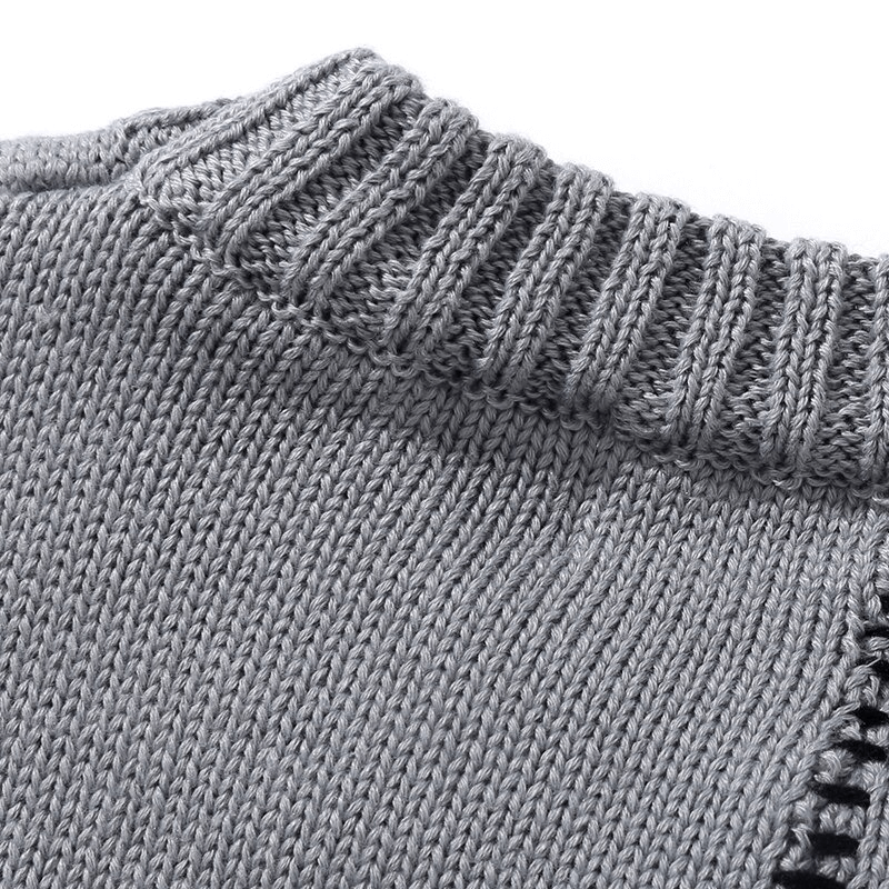 Close-up of a luxurious oversized gray sweater's ribbed neckline showcasing trendy vintage style.