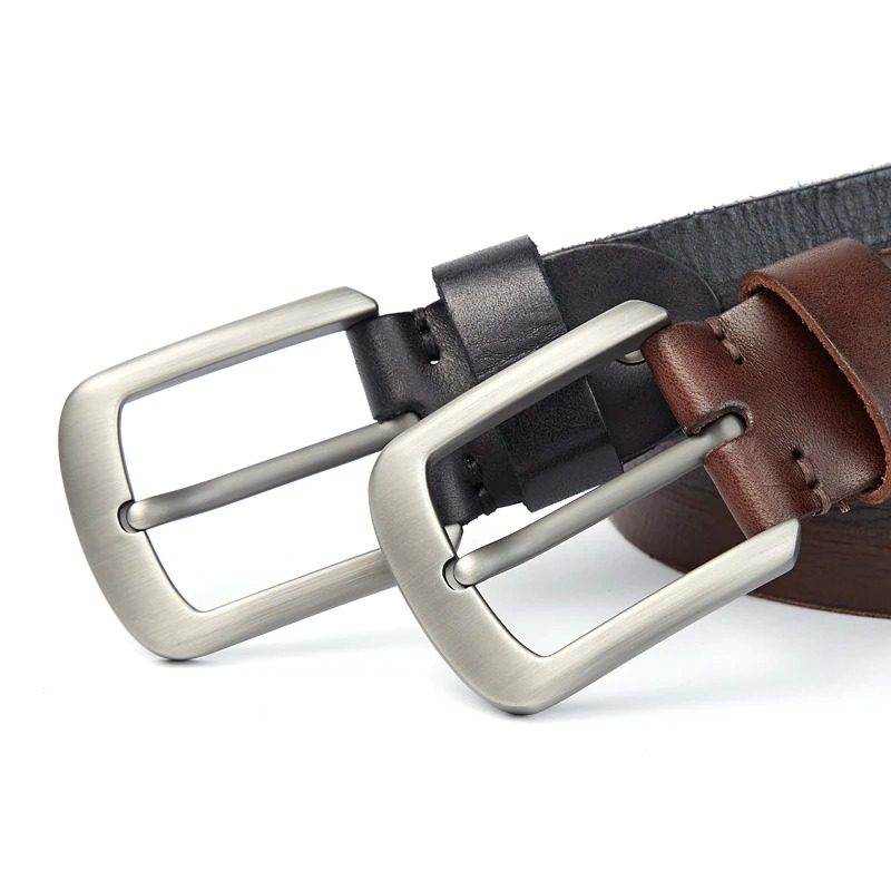 Luxury leather men's belt in black and brown with modern silver buckle, perfect for casual jeans outfits.