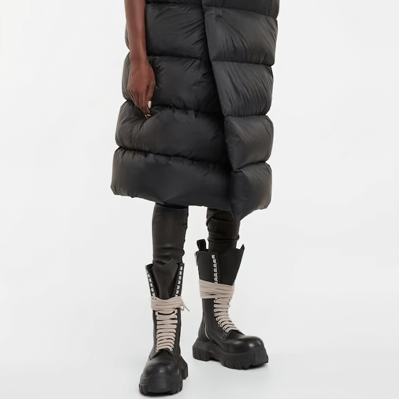 Men's retro motorcycle style lace-up boots with thick soles, paired with a puffer coat for a stylish winter look.