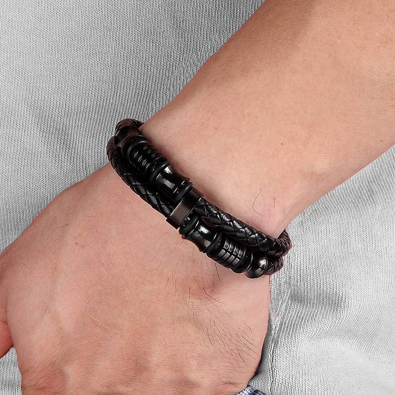 Luxury men's bracelet with genuine leather and stainless steel, styled for casual and rock outfits.