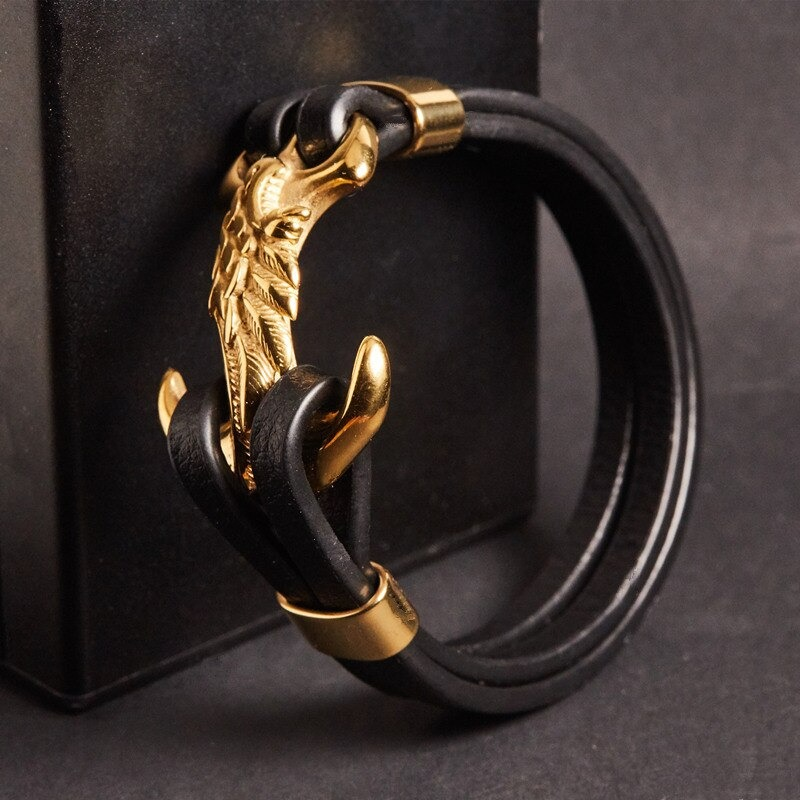 Luxury men's stainless steel bracelet with a wing design, featuring a punk style leather band and golden anchor clasp.