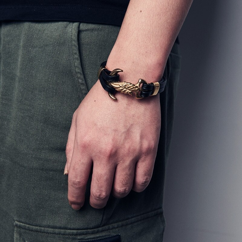 Luxury men's punk bracelet featuring a creative wing clasp and stylish leather band.